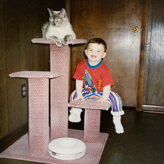 Robert and JC. Dad caved and got Jennie a cat when they moved to Texas. He built her this scratching post. He always pretended to hate the cat, but deep down, he had a lot of love for her =)