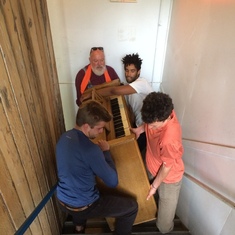 Mark takes the heavy end of a piano.