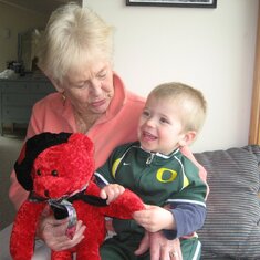 Marolyn with great-grandson Cade and the red bear Bob Tarrant had given to her.