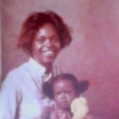 Mom holding Candace and pregnant with Lil Jamie. I loved her hair in this picture : )