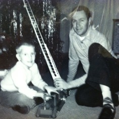 Dad & I with new fire truck which I still have ( 1963)