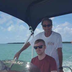 Spring Break, 2017 - Mart with his only grandson, Joshua Waits, driving the boat in the Keys.
