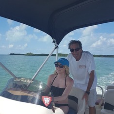 Spring Break, 2017 - Mart with his youngest granddaughter, Sara Waits, driving the boat in the Keys.