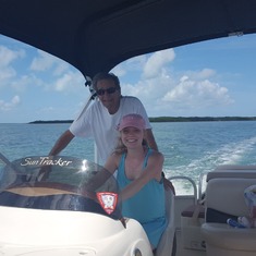 Spring Break, 2017 - Mart with his granddaughter, Jenna Johnson, driving the boat in the Keys.