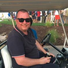 At the Race to Dubai. Blagged a ride in one of the golf buggies, Strongbow in hand. Only for it to go full circle and drop him off where he started