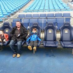 Taking Oliver and Harry on a Tour of the Etihad.  Harry freaked the tour guide out by trying to make a break for it and running onto the pitch.