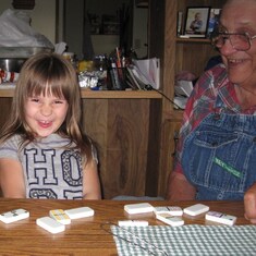 Bella and Great Grandpa Don (Marty's dad) playing dominoes