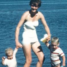 Sarah at the beach with her small children Margo and Michael