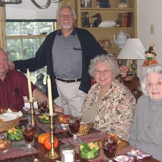 Friends Bill Mild (former student of Mary), Jim Adams, Mary Mild and Mary enjoying a meal in Mary's dining room.