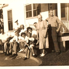 Mary & Anderson family on front steps of Elfers, FL estate's Anderson House; approx. 1941