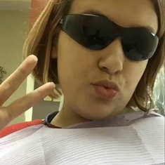 Mary taking a selfie at the dentist.