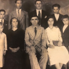 Maria at 12 on right of her parents, with siblings and uncle