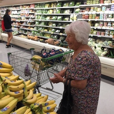 Maria shopping for Bananas