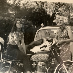 MaryAnne on Alfredo’s bike with her mother, Madeline.