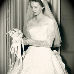 Mom wedding picture looking at flowers
