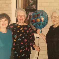 Mom and her sisters celebrating somebody's birthday