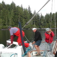 Broughton Islands, 2005.  Dusty, Shack and Phil.  A typical maneuver entailing much groaning--getting Dusty's dinghy launched.  Kae and Kelly smart enough not to get involved.