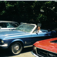 mike sitting in blue mustang