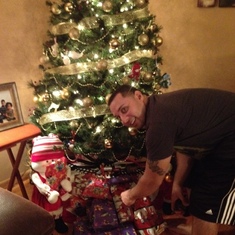 sneaking presents under the tree!
