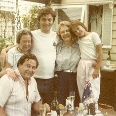 Michael (standing) with Oz family.