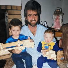 Uncle Mike with Trenton Klippert(left) and Nicholas Klippert (right) Christmas tome 1995. 