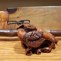 in front - a briar wood griffin like pipe carved for Ray
