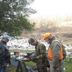 Preparing for target shooting - David, Tony & Jeremy - Mike's elbow behind Tony