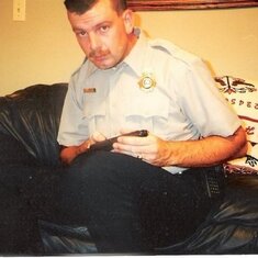 Michael checking out his weapon (he was a Lincoln County Constable) 1998