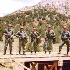 Ft. Carson, 1975, NE National Guard.  SSG Bill Galbraith (far left) formerly of 3rd SF Group and I (second from right) taught our Guard teammates SF explosives.  We built this bridge then blew it up.