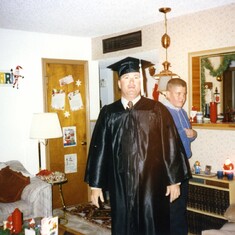 Dad's UTEP graduation, David in the background photobombing.