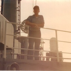 Mike leaning on rail of ship 2