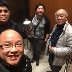 Richmond 2019 - at the elevator at home, after teppanyaki, with underage Ale holding the big Asahi pitcher.