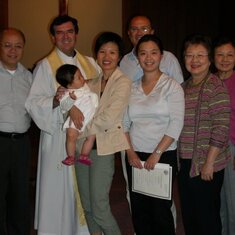 Baby Girl Isa being baptized in Vancouver with family.