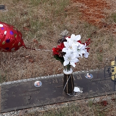 Your beautiful flowers for your birthday. When we put the flowers on your grave the wind was blowing