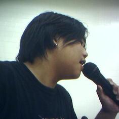 Micheal on stage with his band Weazley Green, at the Pinckneyville Middle School gym in May 2005.