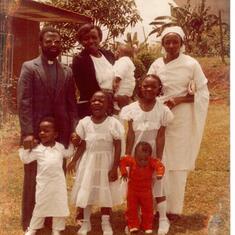 Uncle pastor with Tangyie children at baptism 1981