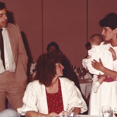 Holding a friend's baby at Fontes wedding June 1984 with her mother