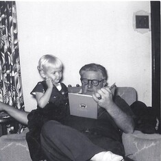 Grandpa reading to Mickey