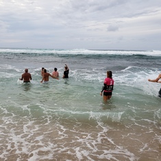 Spreading Mike's ashes in the surf at Hookipa after the memorial.