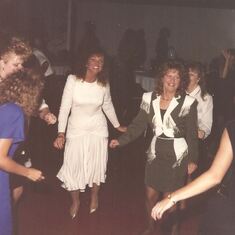Miranda dancing with her sisters and a few cousins .  