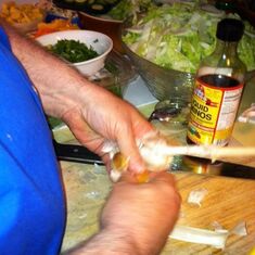 peeling home grown garlic