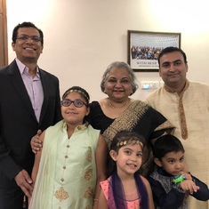 With her sons-in-law and grandchildren