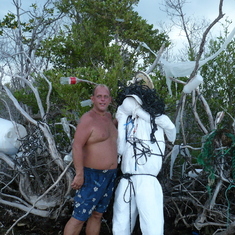 Myron with his "garbage man" that staked his claim at his favorite spot on the beach in Isla Mirada, the Keys, Florida 2008
