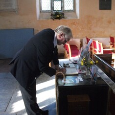 Signing the visitor register at Lanlivery Church
