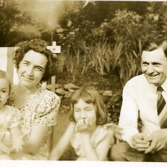 Nan about age 7 (in center) with parents and sister Sally