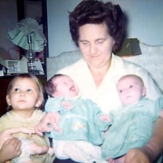 Mom holding grand-baby Traci (on left) and Lauri on right.  Jenni standing in front.
