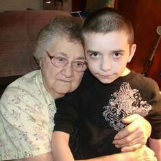 Mom holding grandson, Seth (Lauri).