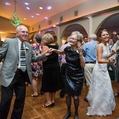 Nancy and Dan Pollnow light up the dance floor at the Mary and Dillon Leisure wedding.