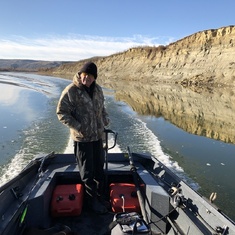 Neill driving his boat up the Red Deer River for some Walleye fishing....