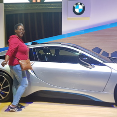 Her loving finer things in life, admiring the BMW i8